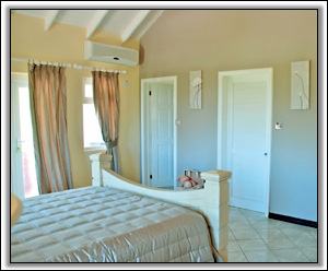 A Cheerful Bedroom At Crimson House - Nevis Villa Rentals