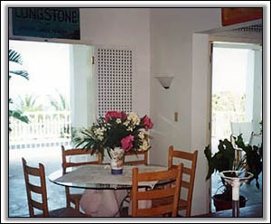 The Dining Area Looks Out On The Gardens - Villa Rentals