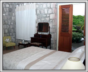 The Master Bedroom Receives Tropical Breezes - Nevis Holiday Homes